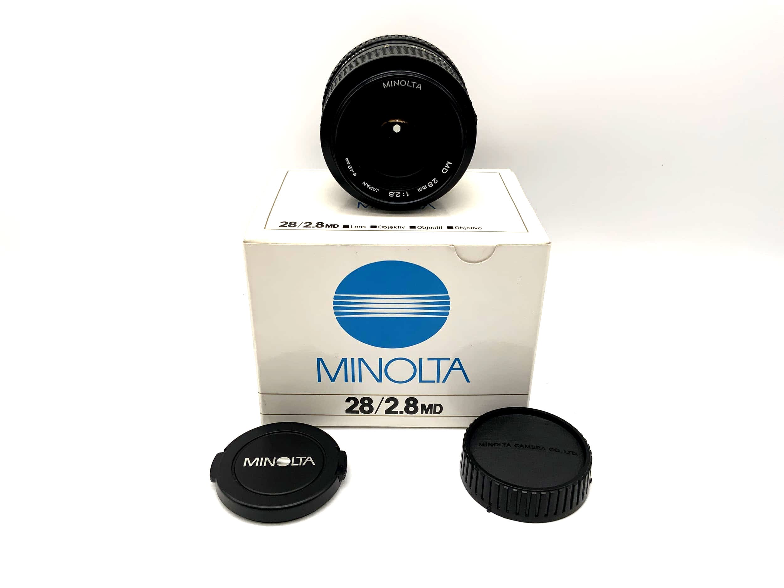 Minolta 28mm 1:2.8 lens with original packaging (Minolta MD)