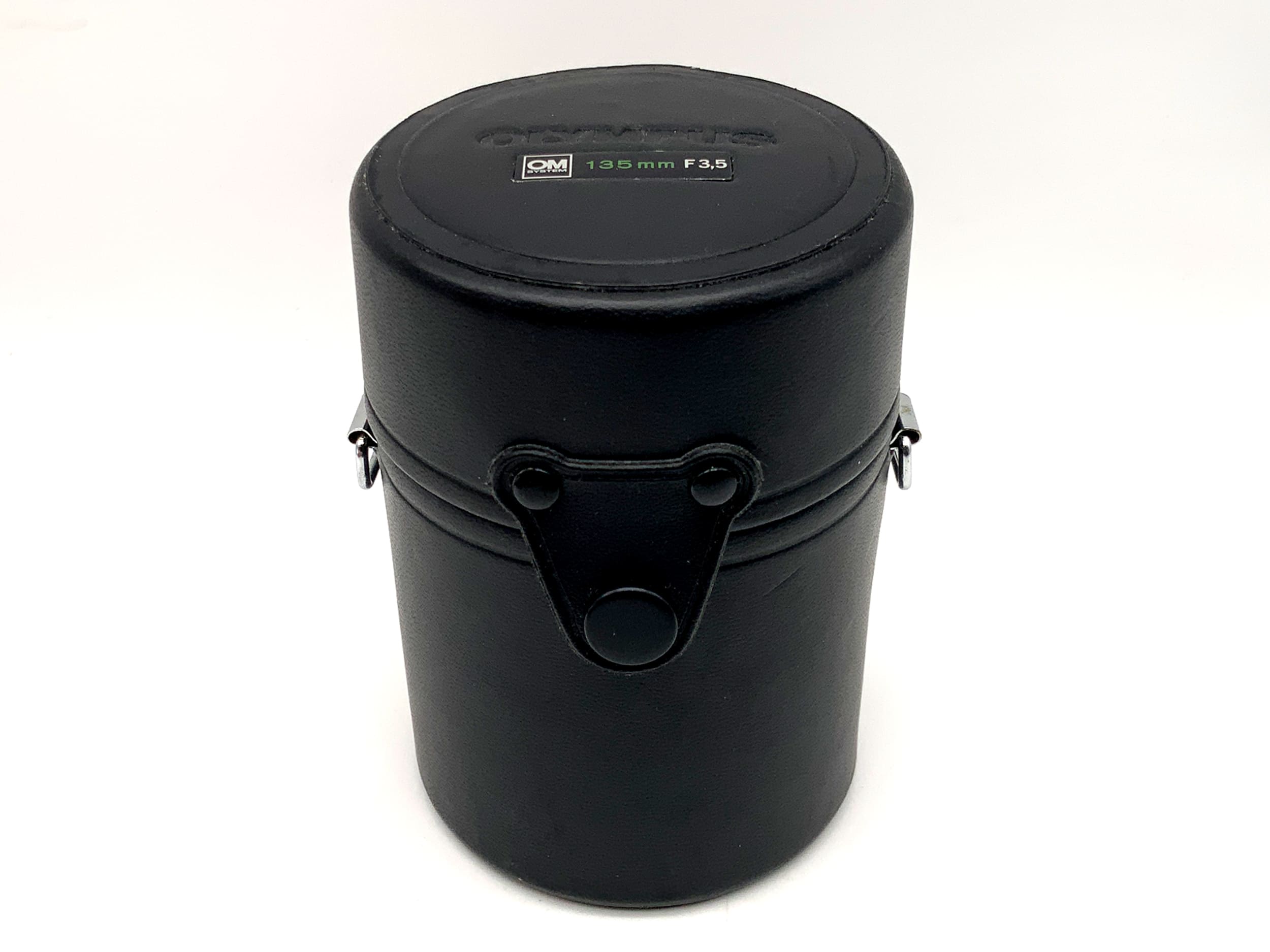 Olympus lens case, black, approx. 11x7.5cm, for OM System 135mm F3.5 lens.