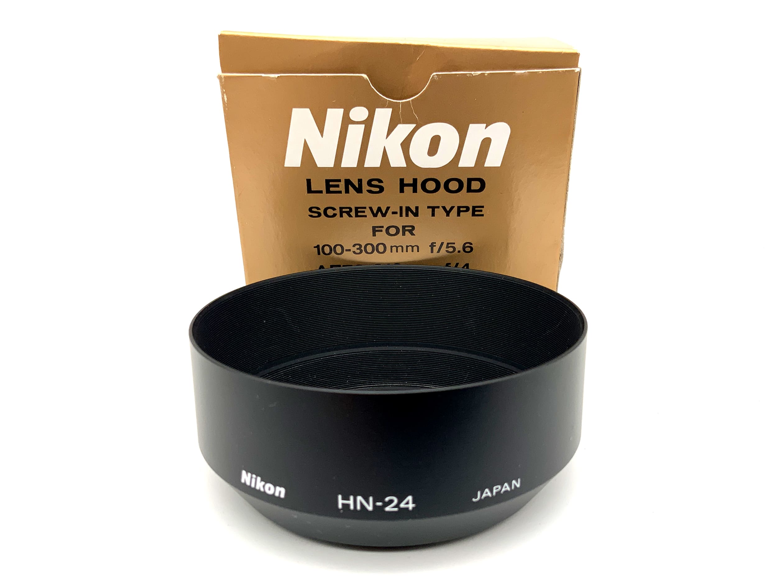 Nikon HN-24 62mm lens hood for Nikkor AF70-210mm in original packaging.