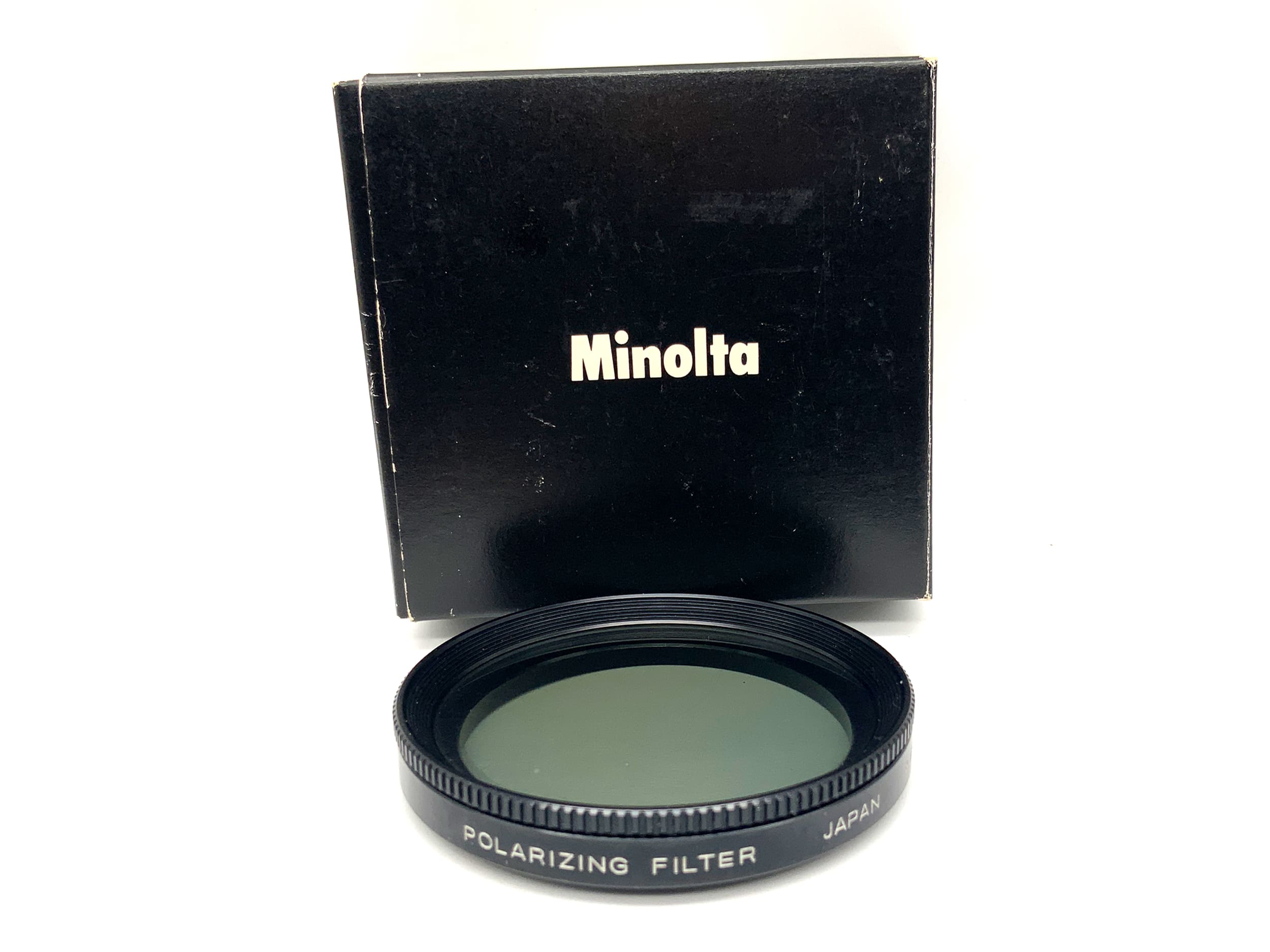 Minolta polarizing filter in original packaging, 49mm circular filter thread