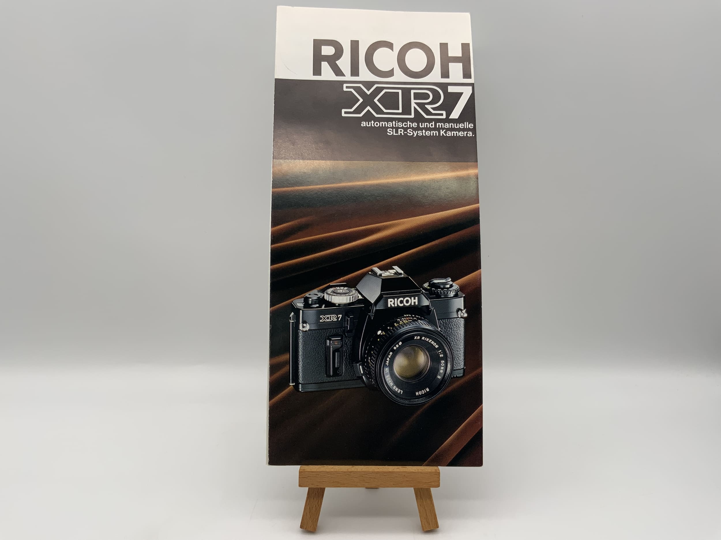 Ricoh XR7 automatic and manual SLR system camera brochure (German)